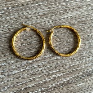 Gold Thin Twist Hoop Earrings from BaubleBar